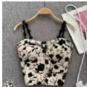 Never worn,washed, top with black floral patterns